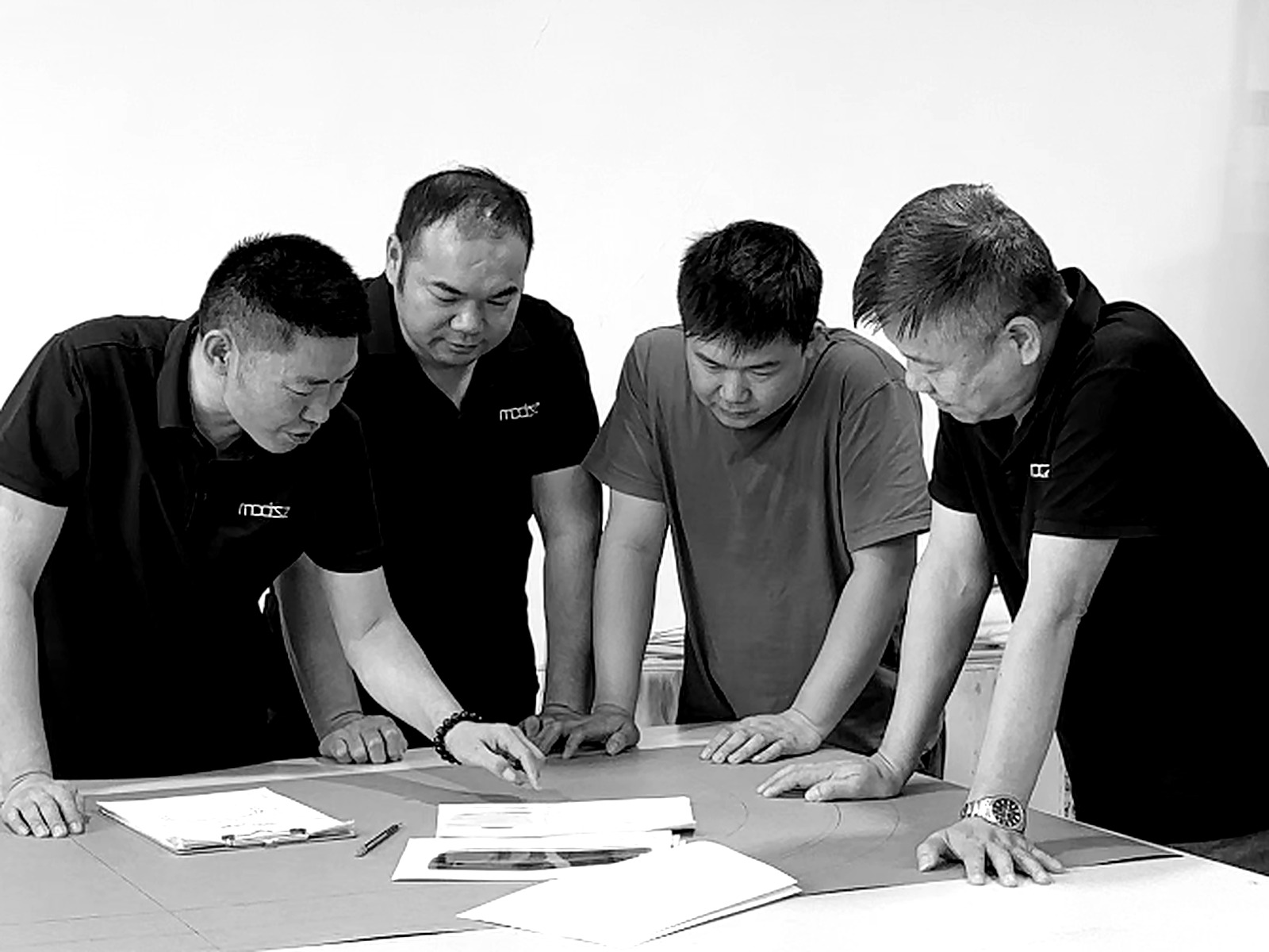 VIATA LIVING craftsmen reviewing patterns and production details together